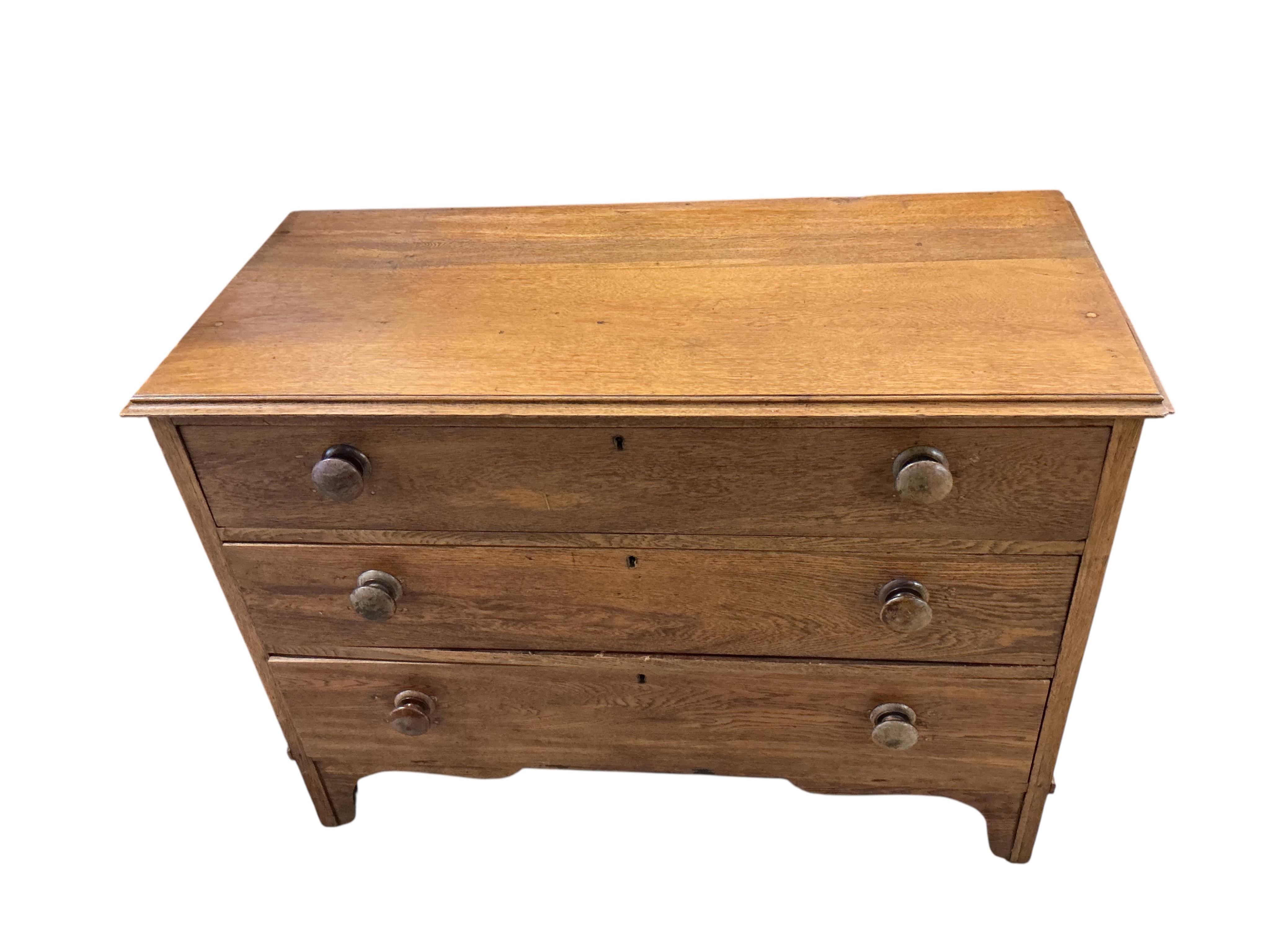 An early 20th century oak three drawer chest, width 106cm, depth 49cm, height 78cm